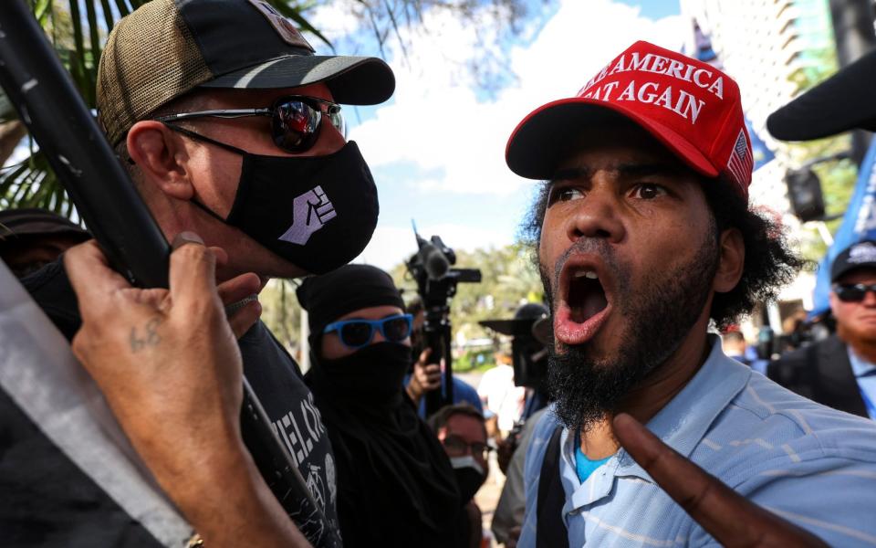 Trump supporters and anti-Trump protesters have clashed outside the conference in Orlando - AP