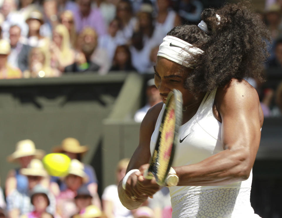 Serena Williams of the United States returns a shot to Garbine Muguruza of Spain during the women's singles final at the All England Lawn Tennis Championships in Wimbledon, London, Saturday July 11, 2015. (Sean Dempsey/Pool Photo via AP)