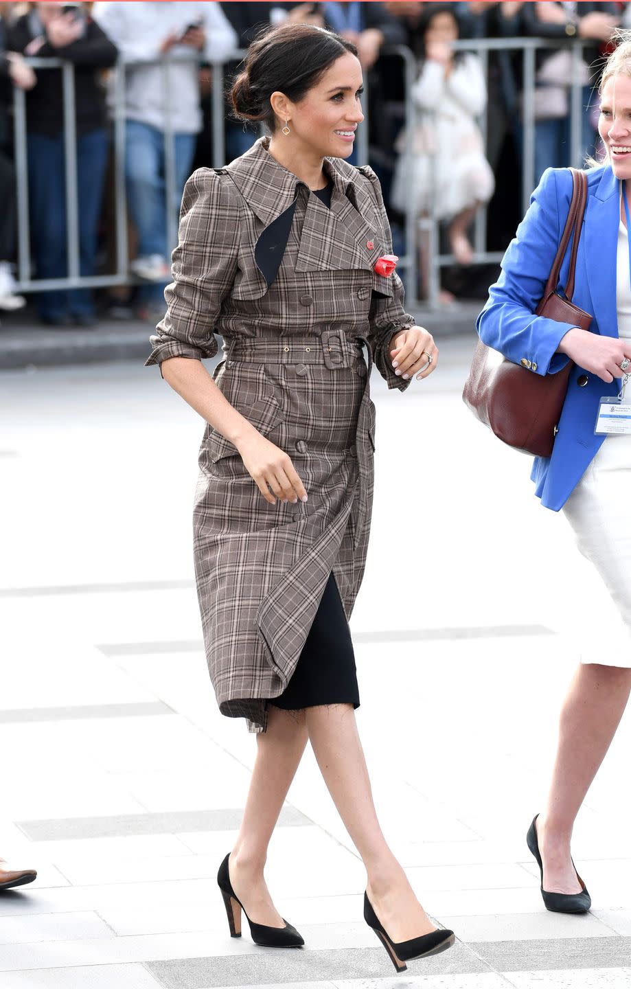 <p>Later that same month, Meghan was spotted wearing a similar ensemble by Karen Walker to the National War Memorial in New Zealand.</p>