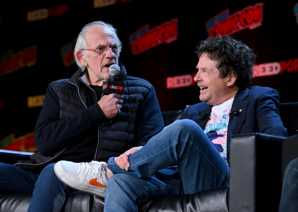 NEW YORK, NEW YORK - OCTOBER 08: Christopher Lloyd and Michael J. Fox speak onstage at the Back to the Future Reunion during New York Comic Con 2022 on October 08, 2022 in New York City. (Photo by Bryan Bedder/Getty Images for ReedPop)