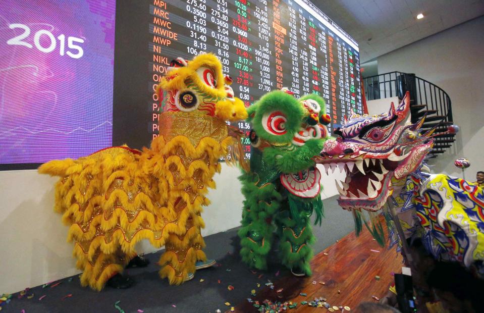 Dancers perform, as part of Chinese Lunar New Year celebrations, on the floor of the Philippine Stock Exchange in Manila's Makati financial district