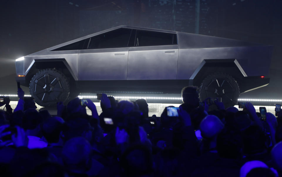 File - The Tesla Cybertruck is unveiled at Tesla's design studio on Nov. 21, 2019, in Hawthorne, Calif. Tesla CEO Elon Musk is expected to give an update on manufacturing problems with long-awaited Cybertruck at an event Thursday marking the first deliveries of the futuristic, angular pickup truck. (AP Photo/Ringo H.W. Chiu, File)