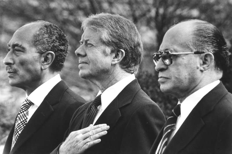 From left to right, Egyptian President Anwar Sadat, U.S. President Jimmy Carter and Israeli Prime Minister Menachem Begin on the lawn of the White House on March 26, 1979, the day they signed a Middle East peace treaty. File Photo by Darryl Heikes/UPI