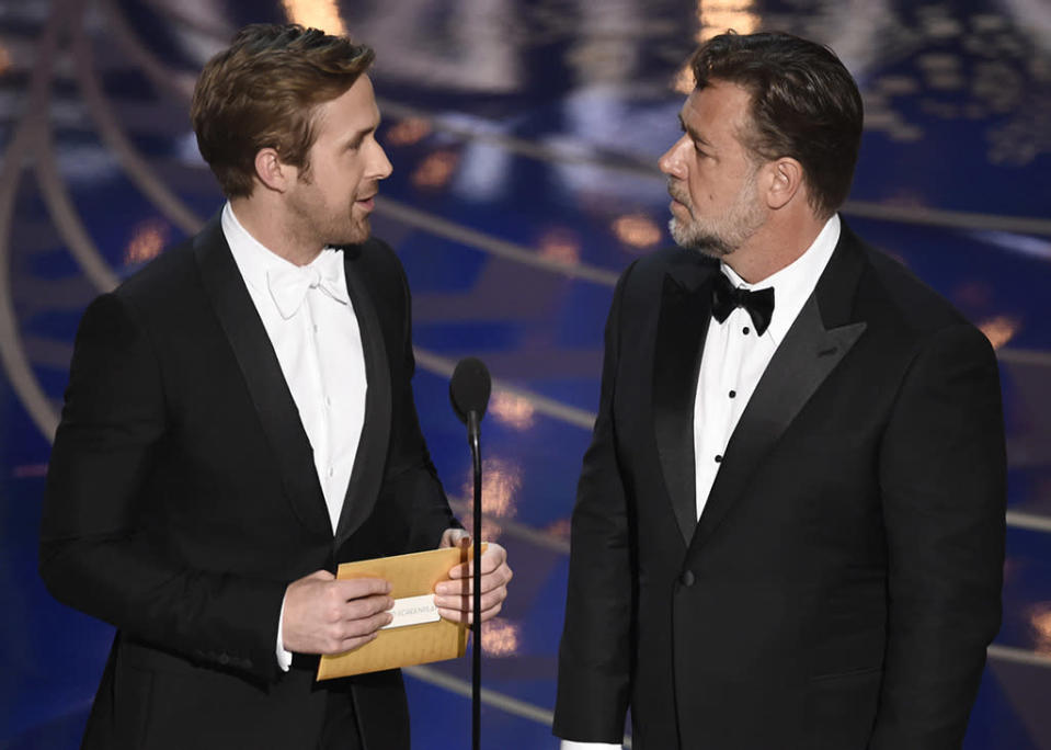 Ryan Gosling, left, and Russell Crowe present the award for best adapted screenplay at the Oscars on Sunday, Feb. 28, 2016, at the Dolby Theatre in Los Angeles. 