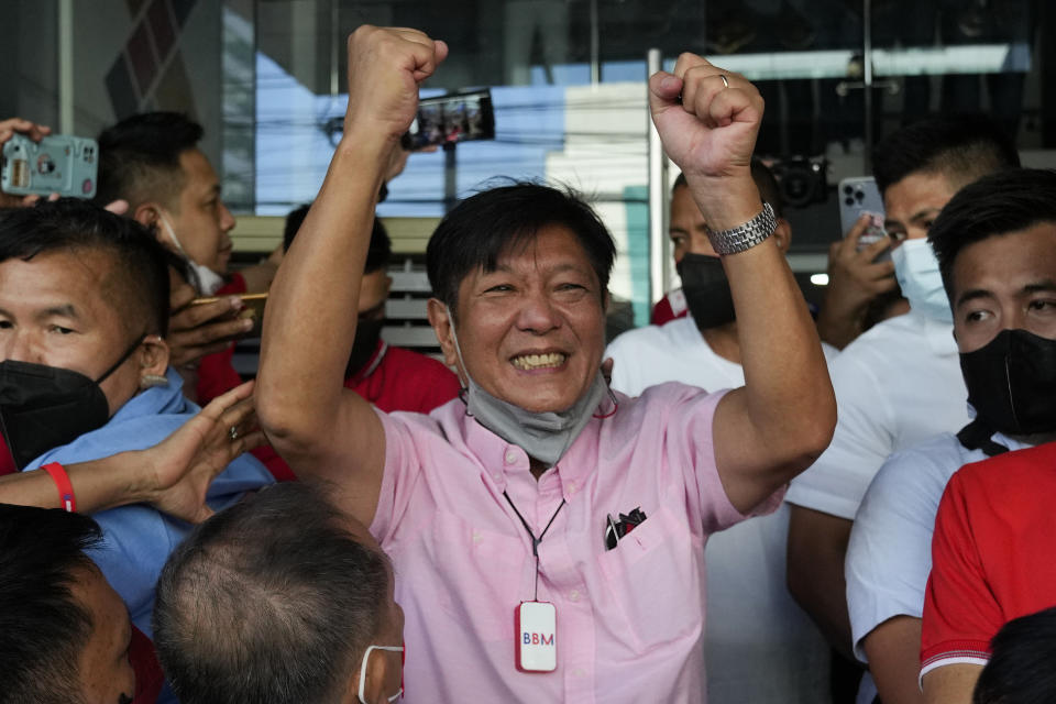 Presidential candidate Ferdinand "Bongbong" Marcos Jr. celebrates outside his headquarters in Mandaluyong, Philippines on Wednesday, May 11, 2022. Marcos, the namesake son of longtime dictator Ferdinand Marcos, apparent landslide victory in the Philippine presidential election is raising immediate concerns about a further erosion of democracy in Asia and could complicate American efforts to blunt growing Chinese influence and power in the Pacific. (AP Photo/Aaron Favila)