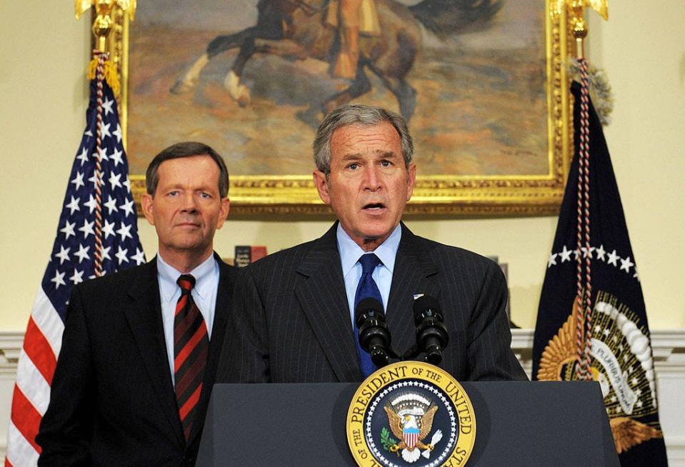 President Bush (center) and Health and Human Services Secretary Mike Leavitt on November 6, 2007.