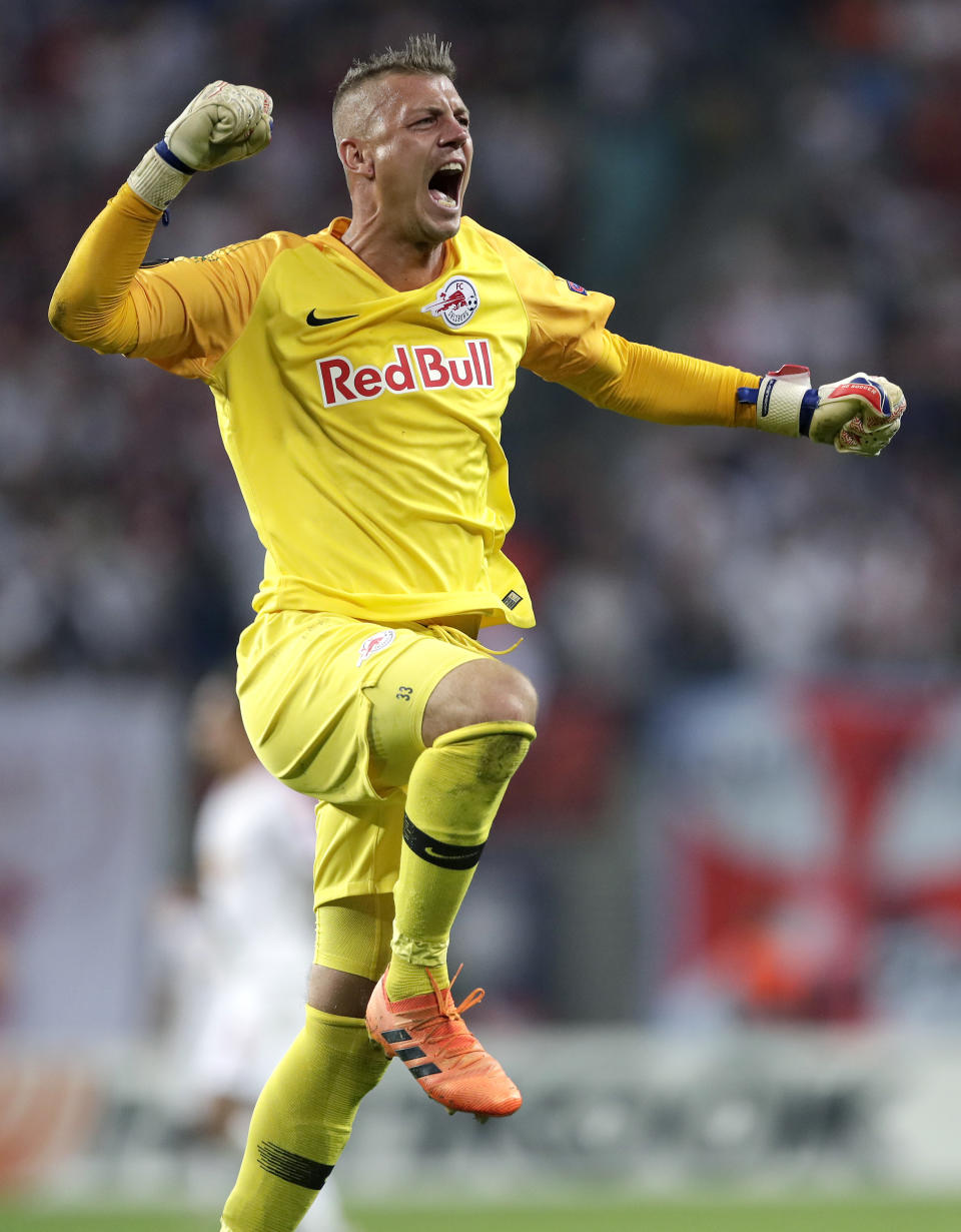 Salzburg goalkeeper Alexander Walke celebrates after his teammate Fredrik Gulbrandsen scored his side's 3rd goal during the UEFA Europa League group B soccer match between RB Leipzig and FC Red Bull Salzburg in Leipzig, Germany, Thursday, Sept. 20, 2018. (AP Photo/Michael Sohn)