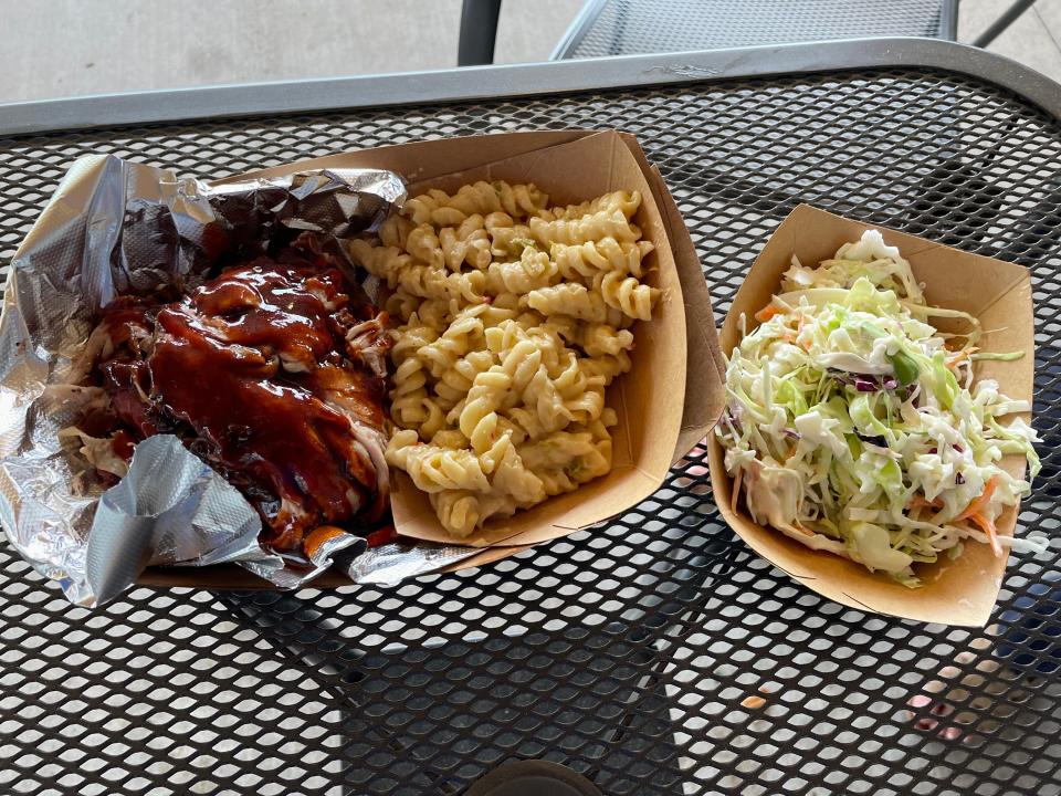 The pulled pork plate at the Smoked Pickle Barbecue food truck at Creekside is served with pickle slaw and green chile mac and cheese.
