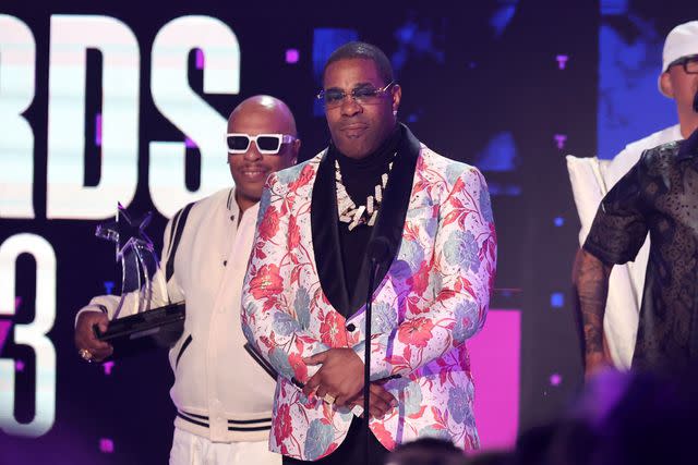 <p>MICHAEL TRAN/AFP via Getty Images</p> Busta Rhymes accepts the lifetime achievement award at the 2023 BET Awards on June 25, 2023