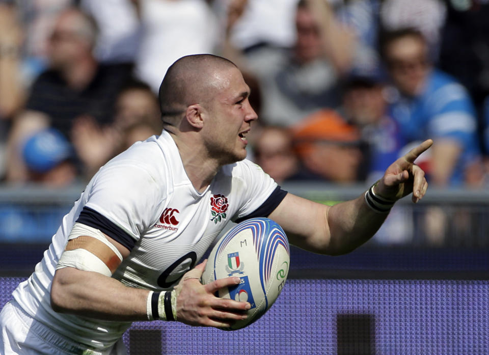 England's Mike Brown celebrates after scoring a try during the Six Nations Rugby Union match between Italy and England at Rome's Olympic stadium, Saturday, March 15, 2014. (AP Photo/Gregorio Borgia)