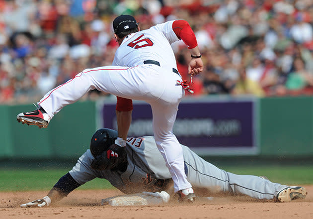 Prince slides in safely with a triple 