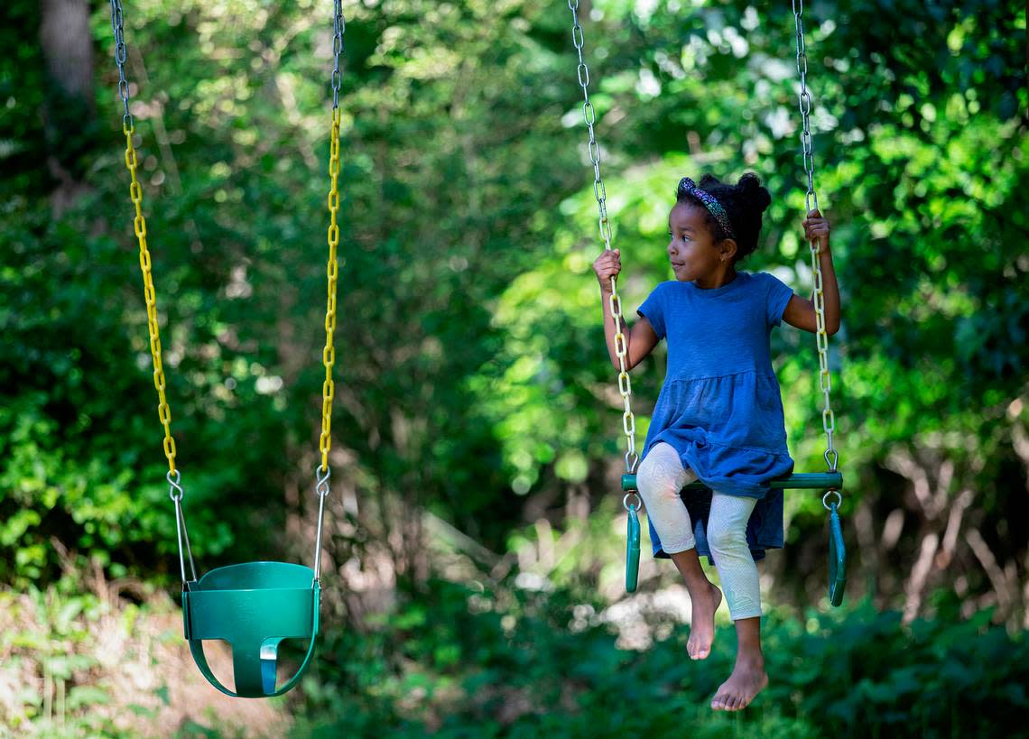 Mavis Daye, 5, plays with her mother at a neighborhood park on Monday, May 9, 2022, in Durham, N.C.