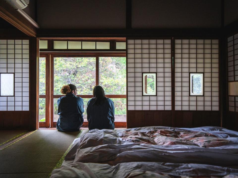 A pair sits in a traditional Japanese ryokan.
