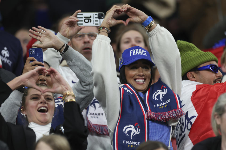 French fans cheer on their team during the Women's World Cup Group F soccer match between France and Jamaica at Sydney Football Stadium in Sydney, Australia, Sunday, July 23, 2023. Almost a third of Australians are foreign-born, according to the Australian Bureau of Statistics, and over half have one or more parents born outside of the country leading to vocal crowds at matches. (AP Photo/Jessica Gratigny)