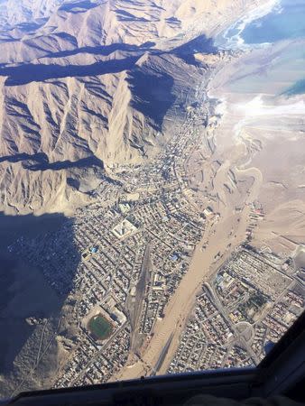 An aereal picture of the town of Chaâ€“aral where increased flow in the river mouth at sea is pictured after a severe flood March 26, 2015. REUTERS/FACH/Fuerza Aerea de Chile(Chilean air force)/Handout via Reuters