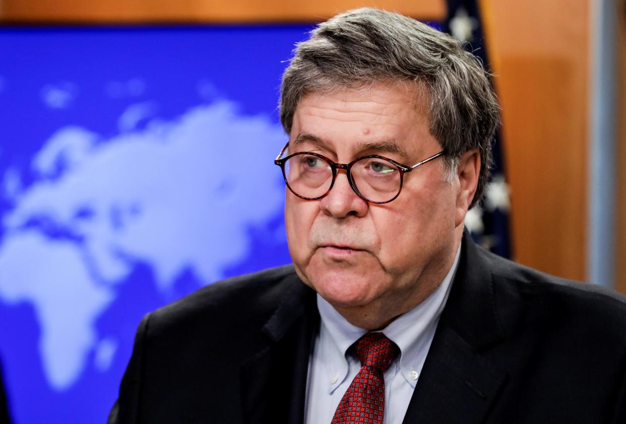 FILE PHOTO - U.S. Attorney General William Barr discusses a Trump administration executive order on the International Criminal Court during a joint news conference at the State Department in Washington, U.S., June 11, 2020. REUTERS/Yuri Gripas/Pool