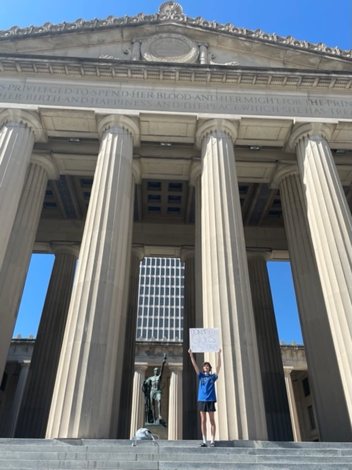 Josh Weisler, 24, stands alone near the Tennessee State Capitol after hundreds attended a gun rally on Thursday (Sheila Flynn)