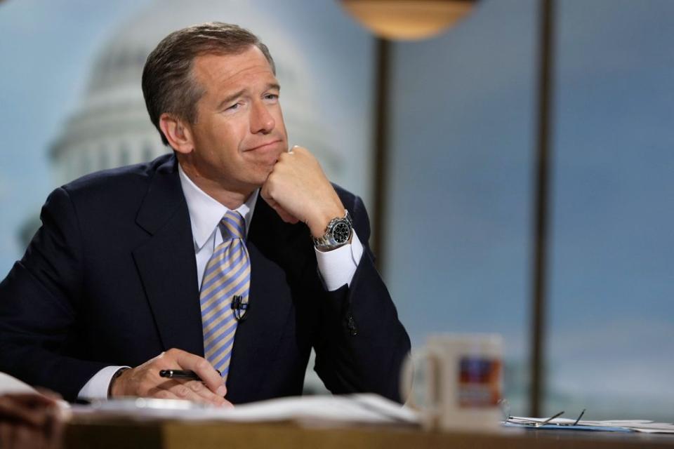 Moderator Brian Williams watches a video which pays tribute to late moderator Tim Russert during a taping of “Meet the Press” at the NBC studios June 22, 2008 in Washington, DC. Williams announced that former Nightly News anchor Tom Brokaw would temporarily host the show through the presidential elections in November, 2008. (Photo by Alex Wong/Getty Images for Meet the Press)