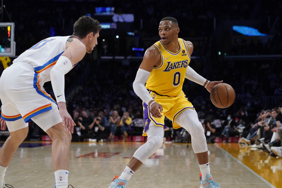 Los Angeles Lakers guard Russell Westbrook (0) dribbles during the first half of an NBA basketball game against the Oklahoma City Thunder Thursday, Nov. 4, 2021, in Los Angeles. (AP Photo/Marcio Jose Sanchez)