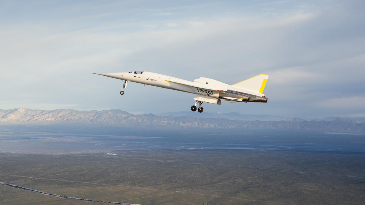  A needle-nosed white jet aircraft in flight. 