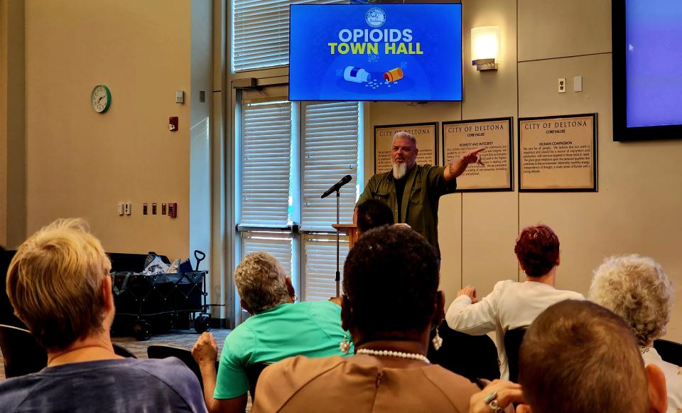 Detective Sgt. Jimmie Carlisle, who leads the Volusia sheriff's Deltona narcotics team, speaks during a town hall on opioids held July 12 at City Hall in Deltona. He said the sheriff's office is building stronger cases against dealers by making multiple undercover buys.