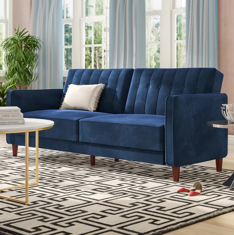 Save up to 75 percent on furniture during Wayfair’s Presidents’ Day sale. Shop it: Willa Arlo Interiors Nia Pin Tufted Convertible Sofa, $331 (was $368), <a href="https://fave.co/2WXhFei" rel="noopener" target="_blank" data-ylk="slk:wayfair.com;elm:context_link;itc:0;sec:content-canvas" class="link ">wayfair.com</a>. (Photo: Wayfair)