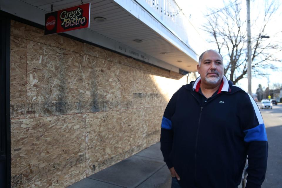 Hakim Said, the owner of Greg’s Bistro, stands outside the closed bar and pizzeria in Hampton. Said said the restaurant has been shut down since December due to a broken pipe under the bar. This is the second time Greg’s Bistro has closed in a few months, after a drunken driver crashed into the building in November 2022.