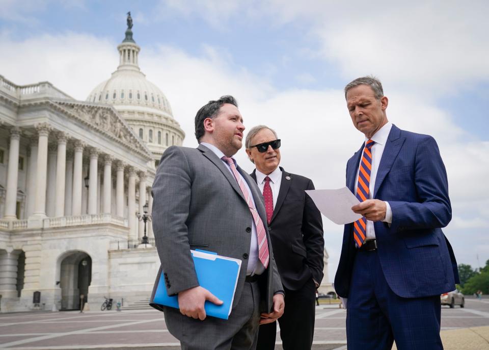 May 30, 2023; Washington, DC, USA; Freedom Caucus Chair Rep. Scott Perry, (R-PA), right, along with Rep. Andy Biggs (R-AZ), center, organize before the start of a House Freedom Caucus press conference outside of the U.S. Capitol on Tuesday, May 30, 2023 opposing the current debt ceiling agreement negotiated by House Speaker Kevin McCarthy and President Joe Biden.