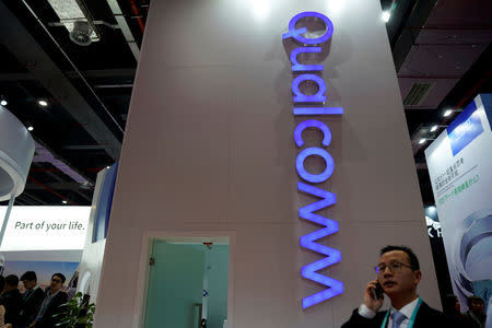 FILE PHOTO: A Qualcomm sign is seen during the China International Import Expo (CIIE), at the National Exhibition and Convention Center in Shanghai, China November 6, 2018. REUTERS/Aly Song/File Photo