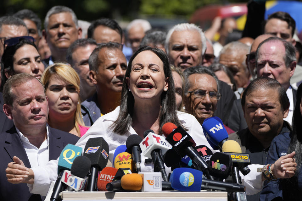 Opposition coalition presidential hopeful Maria Corina Machado gives a press conference outside her campaign headquarters in Caracas, Venezuela, Monday, Jan. 29, 2024, days after the country's highest court upheld a ban on her candidacy. (AP Photo/Ariana Cubillos)