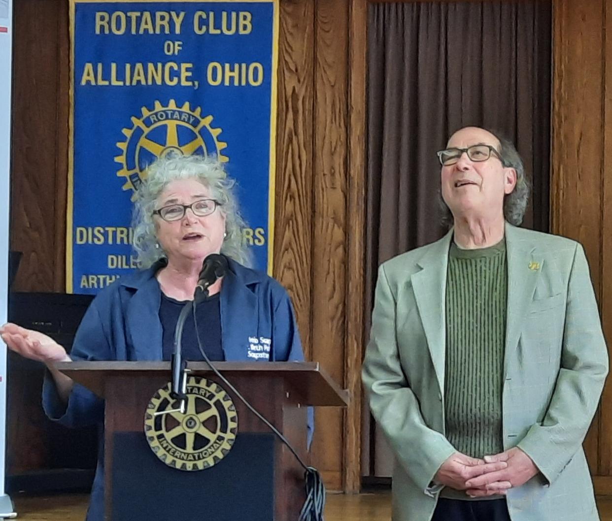 Beth and Dennis Polito of Cielo Soaps and Wine at the Crossing speak to members of Rotary Club of Alliance.