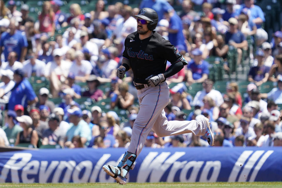 Miami Marlins' Adam Duvall rounds the bases after hitting a two-run home run in the first inning of a baseball game against the Chicago Cubs in Chicago, Saturday, June 19, 2021. (AP Photo/Nam Y. Huh)