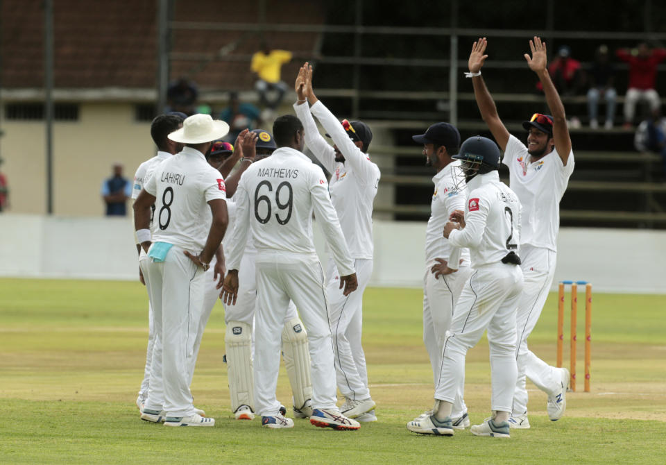 Sri Lanka players celebrate a wicket during their match against Zimbabwe at Harare Sports Club, Monday, Jan. 20, 2020. (AP Photo/Tsvangirayi Mukwazhi)