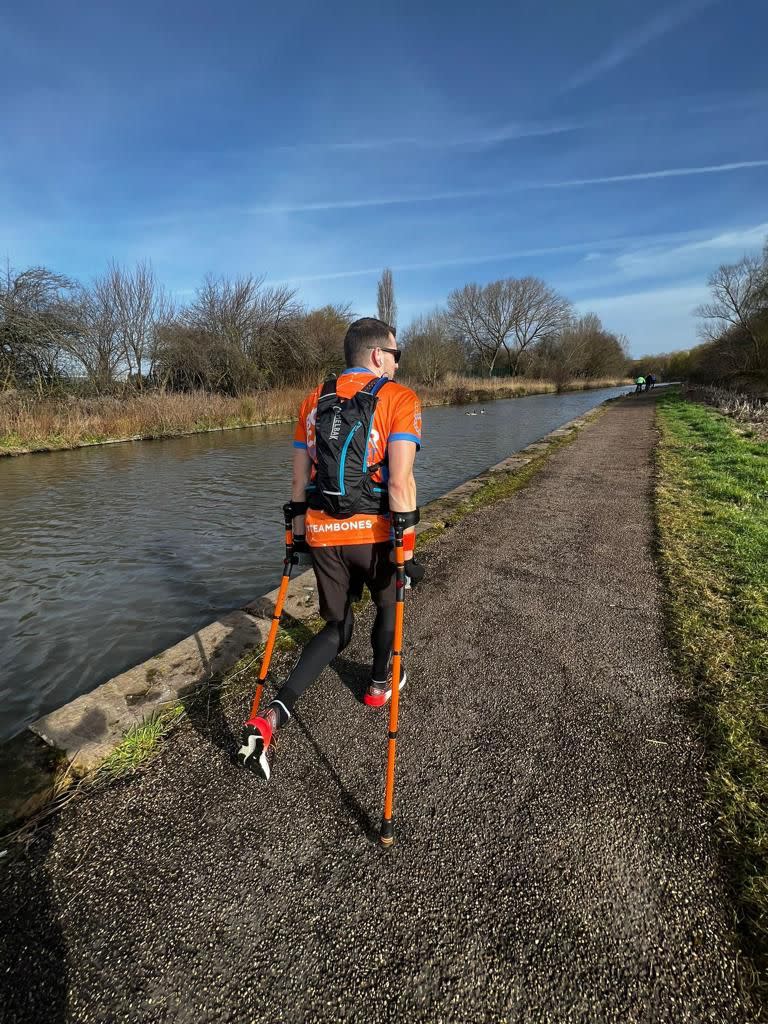 Man walking with crutches 