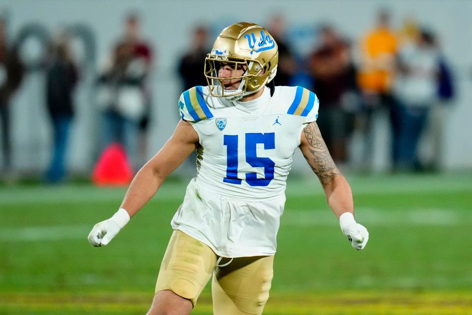 UCLA linebacker Laiatu Latu (15) watches the ball during the second half of an NCAA college football game against Arizona State in Tempe, Ariz., on Nov. 5. UCLA won 50-36.