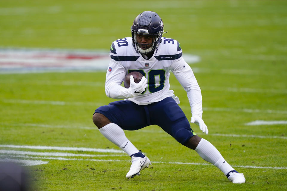 Seattle Seahawks running back Carlos Hyde (30) runs with the ball during the first half of an NFL football game against the Washington Football Team, Sunday, Dec. 20, 2020, in Landover, Md. (AP Photo/Susan Walsh)