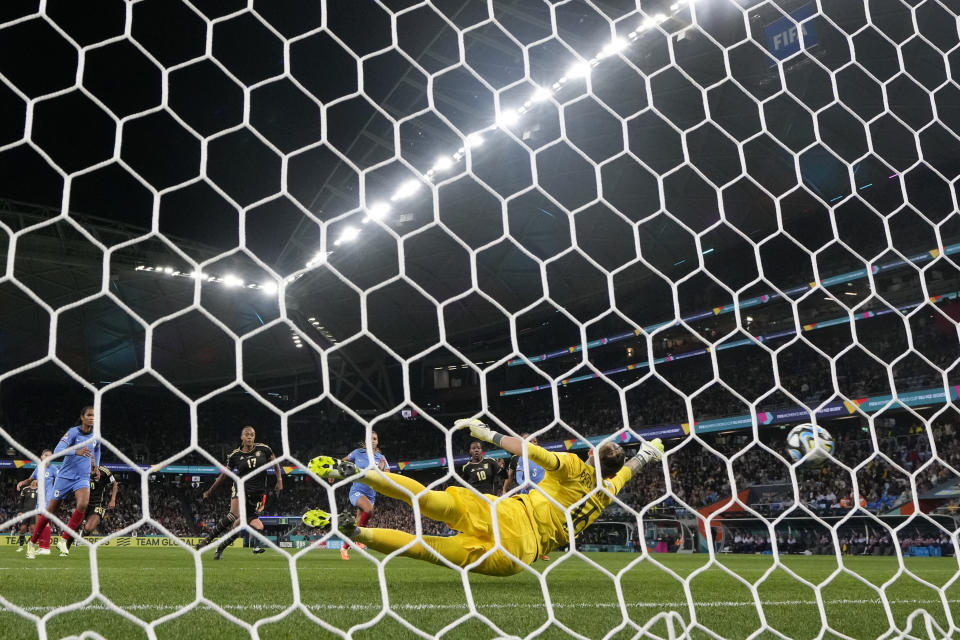 France's goalkeeper Pauline Peyraud-Magnin dives to make a save after a free kick from Jamaica during their Women's World Cup Group F soccer match at the Sydney Football Stadium in Sydney, Australia, Sunday, July 23, 2023. (AP Photo/Rick Rycroft)