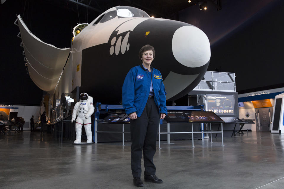 Wendy Lawrence, 58, is a retired U.S. Navy captain and former NASA astronaut. Here she's pictured&nbsp;by the space shuttle trainer that was used for astronaut training on Feb. 28, 2018. It's now at the Museum of Flight in Seattle.