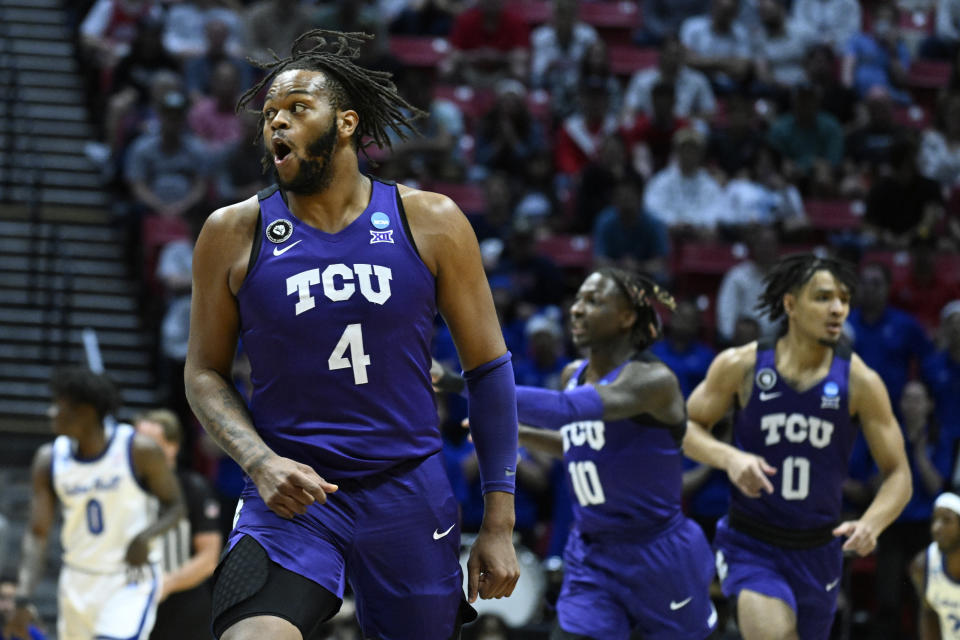 FILE - TCU center Eddie Lampkin (4) reacts with teammates during the first half of a first-round NCAA college basketball tournament game against Seton Hall, March 18, 2022, in San Diego. Lampkin is among the returning starters from a team that won TCU's first NCAA tournament game in 35 seasons last March. (AP Photo/Denis Poroy, File)
