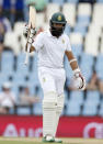 South Africa's Hashim Amla raises his bat as he celebrates his half century during the fourth cricket test match against England in Centurion, South Africa, January 22, 2016. REUTERS/Siphiwe Sibeko