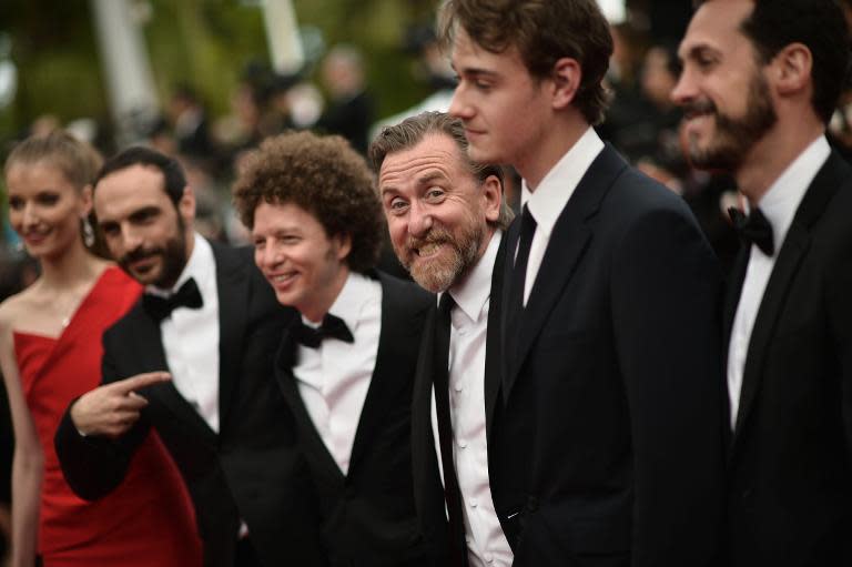 Mexican director Michel Franco (C) and British actor Tim Roth (3rR) arriving for the Cannes closing ceremony