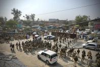 Policemen are deployed at the Haryana-New Delhi border to block protesting farmers from marching to the capital in New Delhi, India, Thursday, Nov.26, 2020. The farmer's have been protesting against the federal agriculture laws. (AP Photo/Manish Swarup)