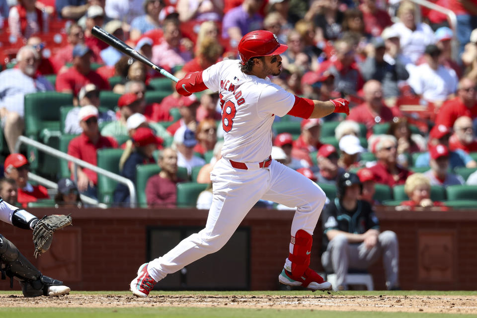 St. Louis Cardinals' Nolan Arenado hits an RBI single during the sixth inning of a baseball game against the Arizona Diamondbacks, Wednesday, April 24, 2024, in St. Louis. (AP Photo/Scott Kane)