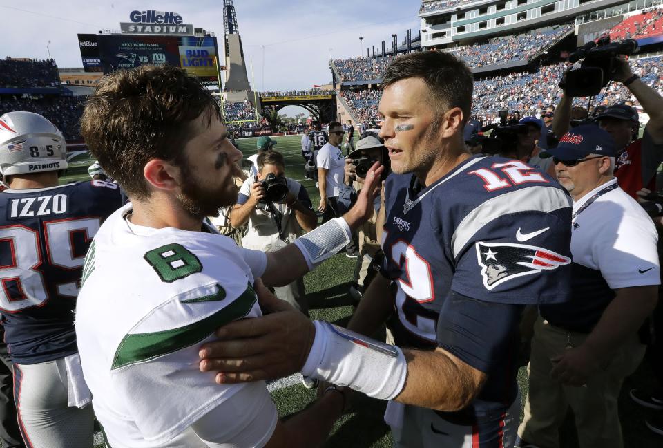 New York Jets quarterback Luke Falk, left, and New England Patriots quarterback Tom Brady speak at midfield after an NFL football game, Sunday, Sept. 22, 2019, in Foxborough, Mass. (AP Photo/Steven Senne)