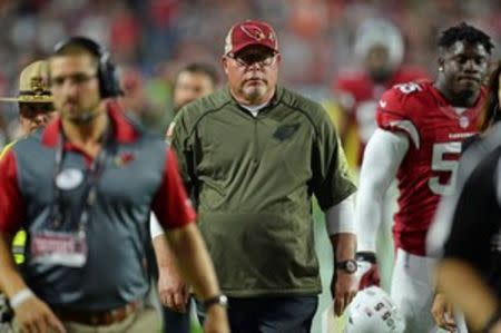 Arizona Cardinals head coach Bruce Arians leaves the field after the first half against the Cincinnati Bengals at University of Phoenix Stadium. The Cardinals won 34-31. Mandatory Credit: Joe Camporeale-USA TODAY Sports
