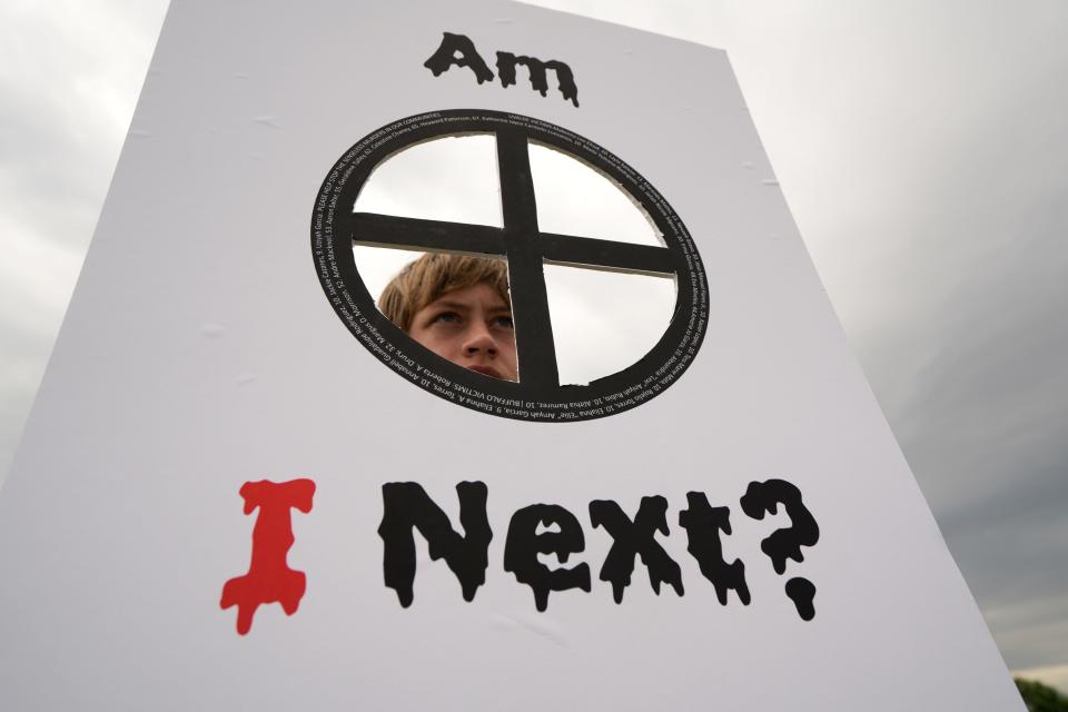 Colin Lee, 12, of Arlington, Virginia, holds a sign on Saturday at the March For Our Lives rally in front of the Washington Monument.