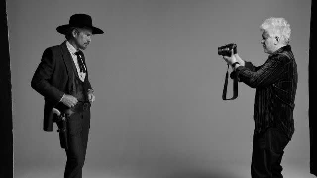 a man holding a camera and a man holding a camera