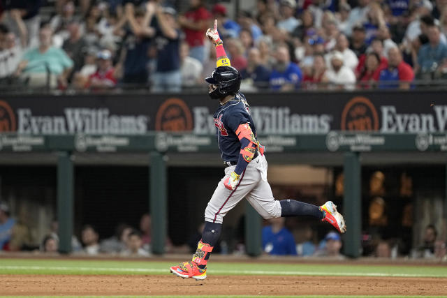 Atlanta Braves' Eddie Rosario celebrates his solo home run against