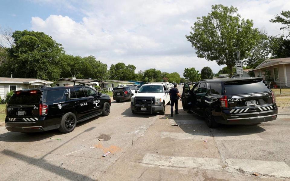 Members of the Fort Worth Police Department investigate a fatal shooting on Friday, July 5, 2024, that occurred the evening prior near the intersection of Castleman Street and Comanche Street.