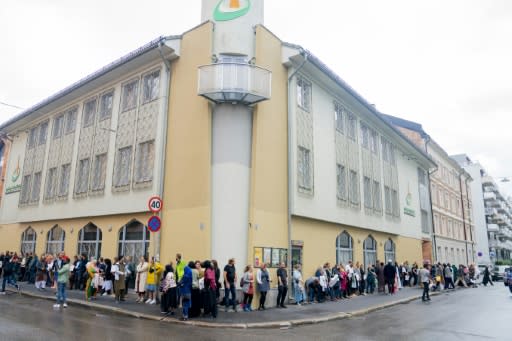 Non-Muslim Norwegians lined up outside an Oslo mosque to show support on Sunday morning